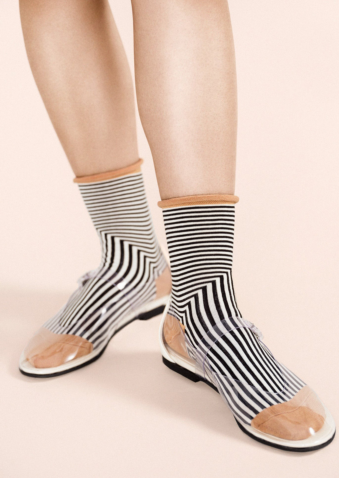 Black and white geo stripe socks with camel colored contrast.