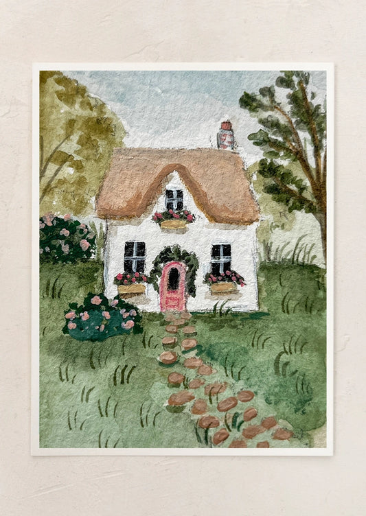 Watercolor painting of a quaint cottage with a thatched roof and garden path.