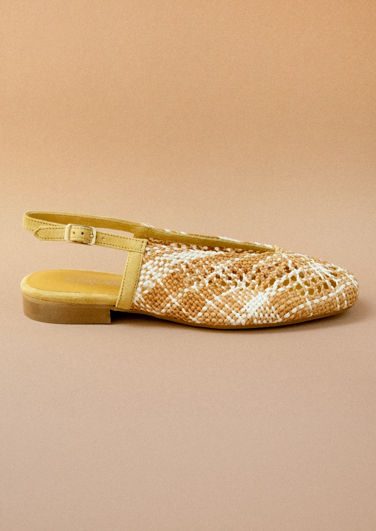 A pair of crochet slingback heeled sandals.