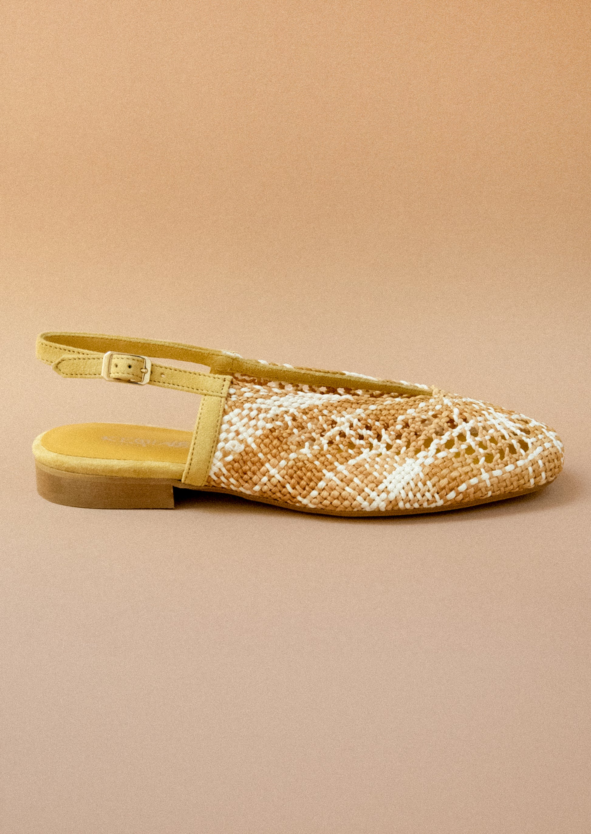 A pair of crochet slingback heeled sandals.