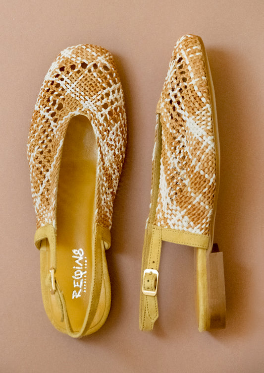 A pair of crochet slingback heeled sandals.