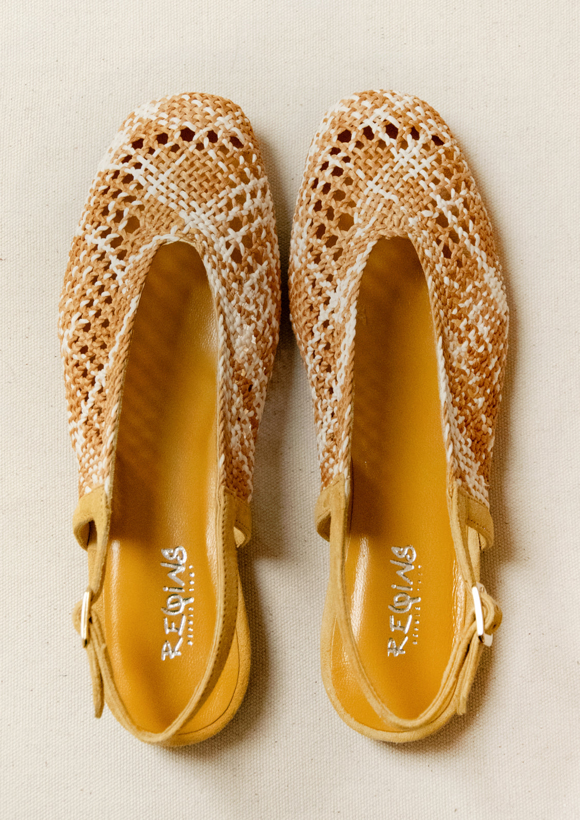A pair of crochet slingback heeled sandals.