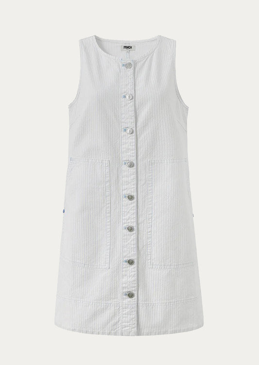 White sleeveless dress with buttons on a light gray background