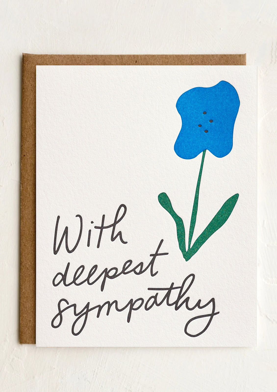 A card with image of blue flower, text reads "With deepest sympathy".