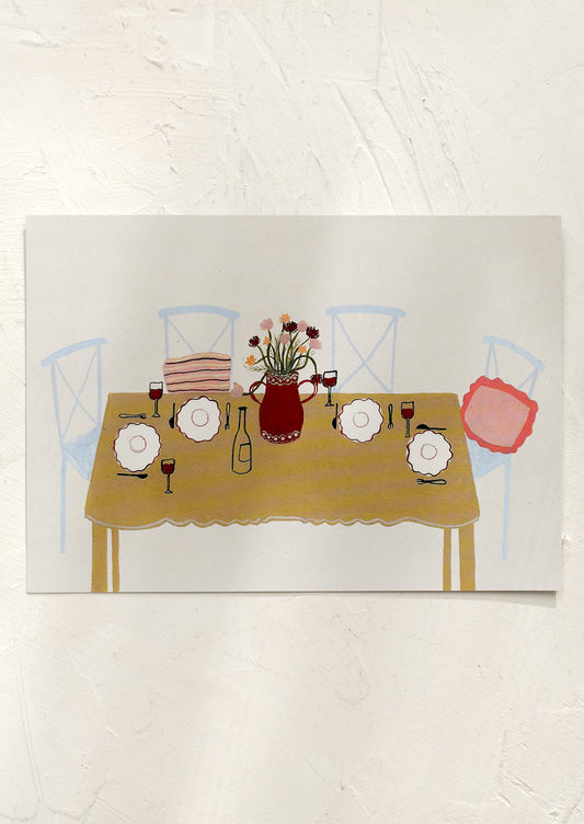 An art print of chairs around a table set for dinner.