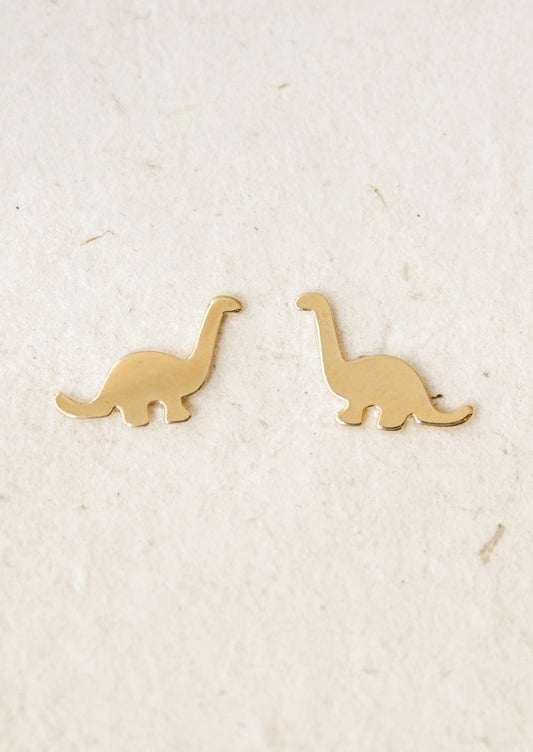A pair of gold dinosaur stud earrings.