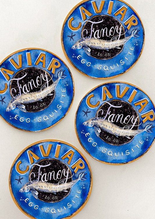 A set of coasters with caviar tin print.