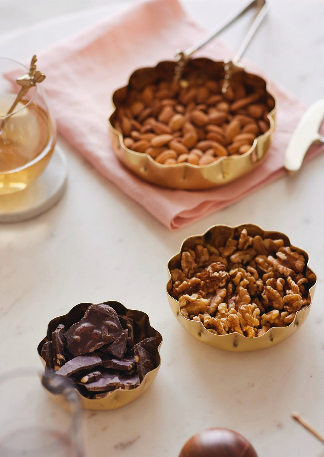 Round scalloped brass bowls in three sizes.