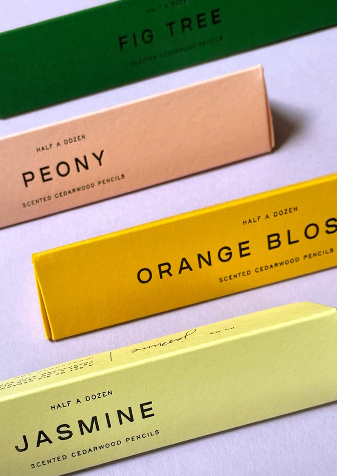 Colored packaging holding scented pencils.