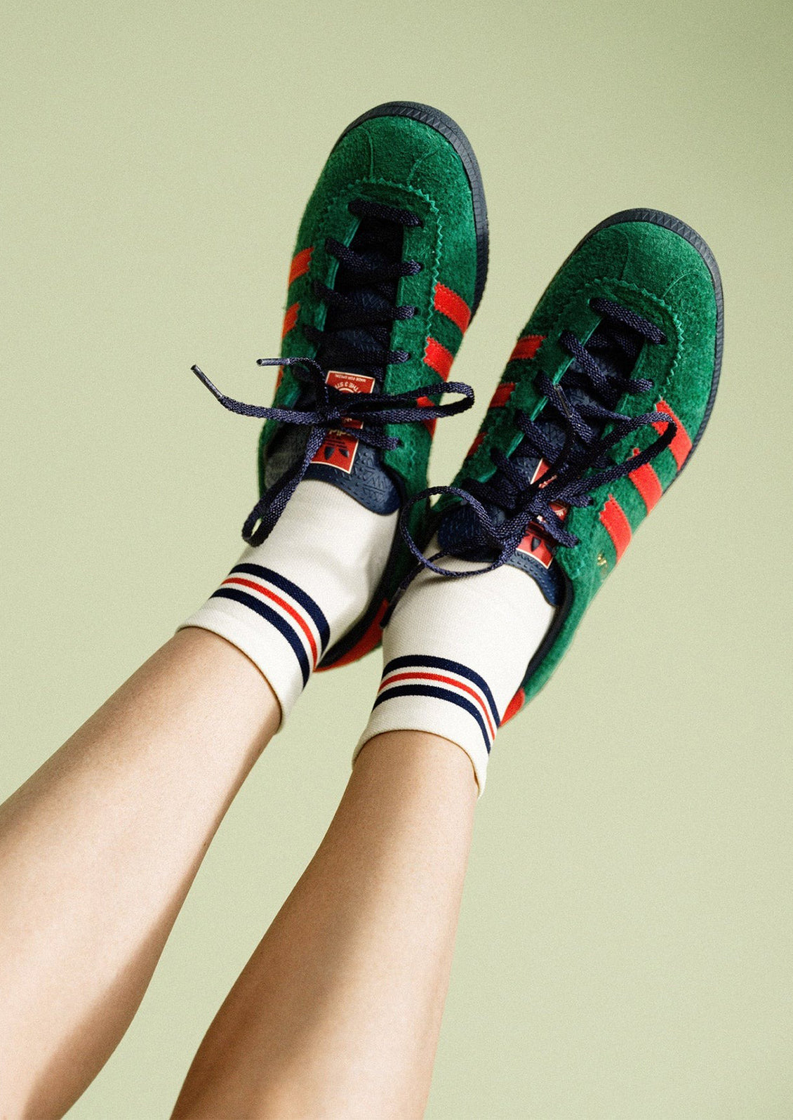 A pair of sporty ankle striped socks in white.