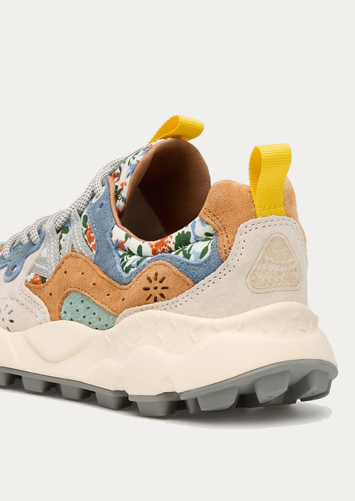 A pair of sneakers with floral print upper.