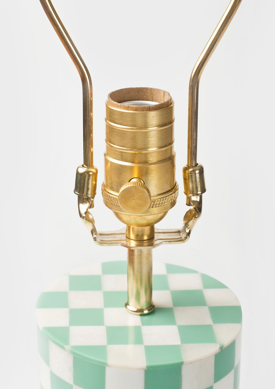 A table lamp with brass hardware.