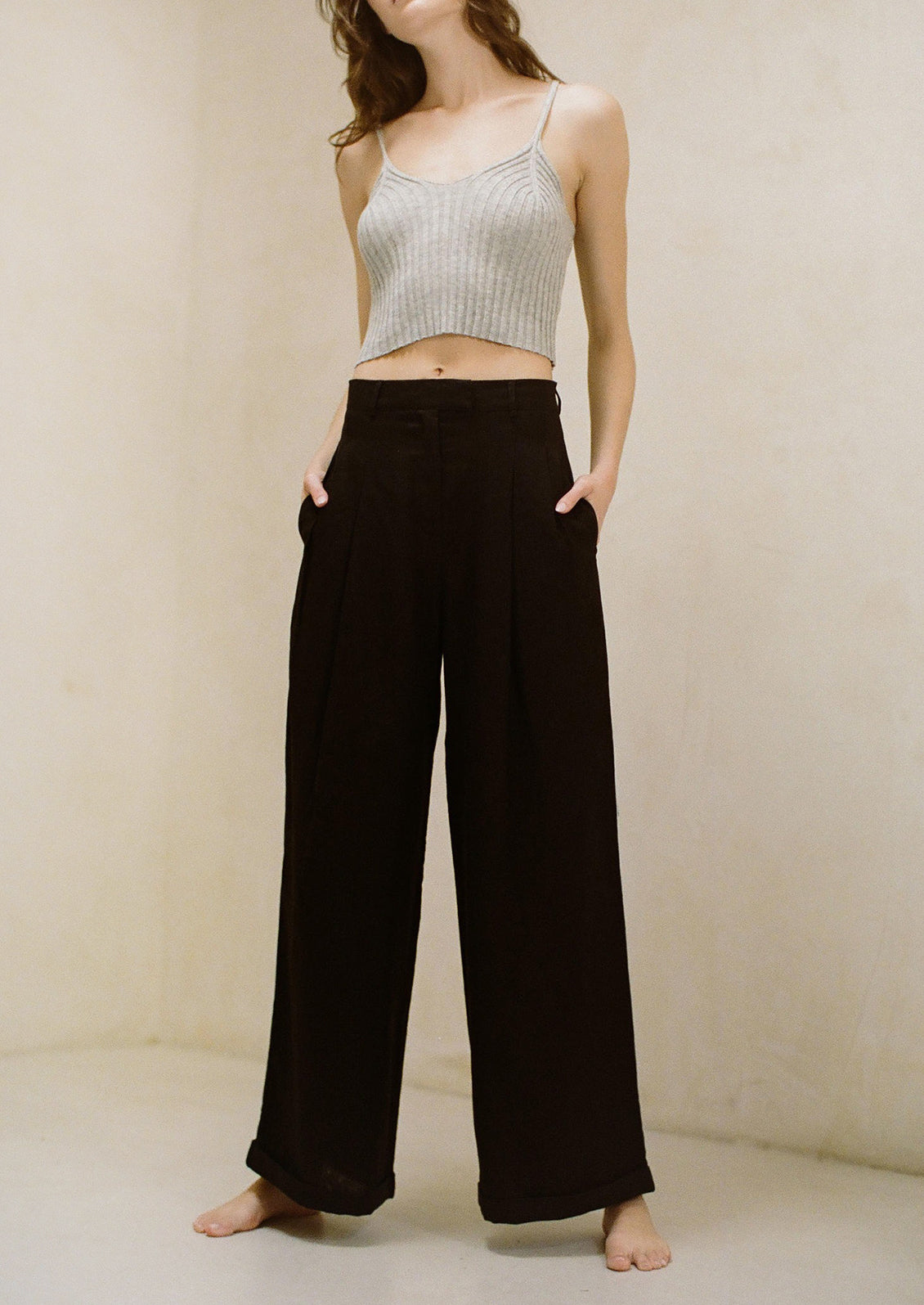 A pair of wide leg black linen pants.