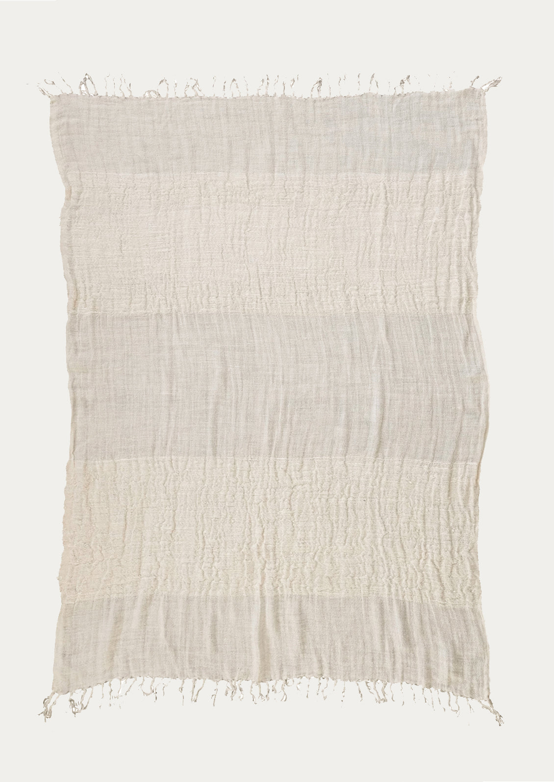 An ivory linen throw with a mix of different weave gauges.