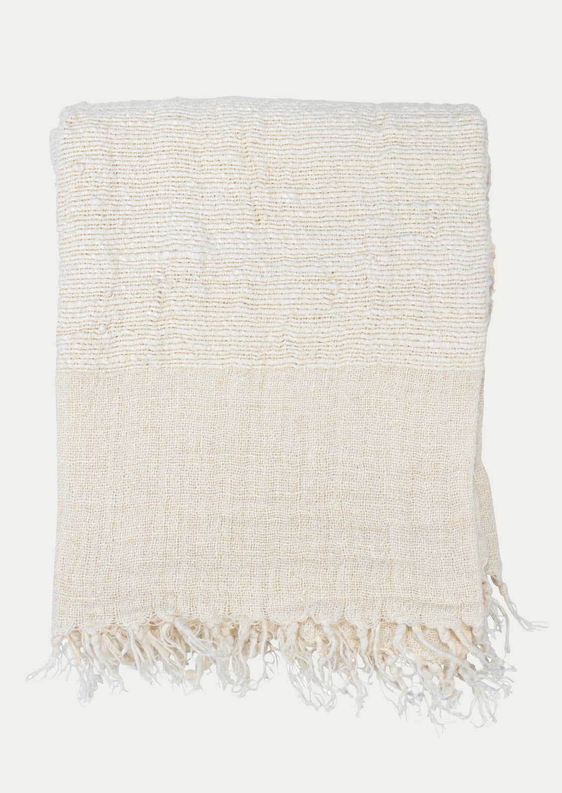 An ivory linen throw with a mix of different weave gauges.