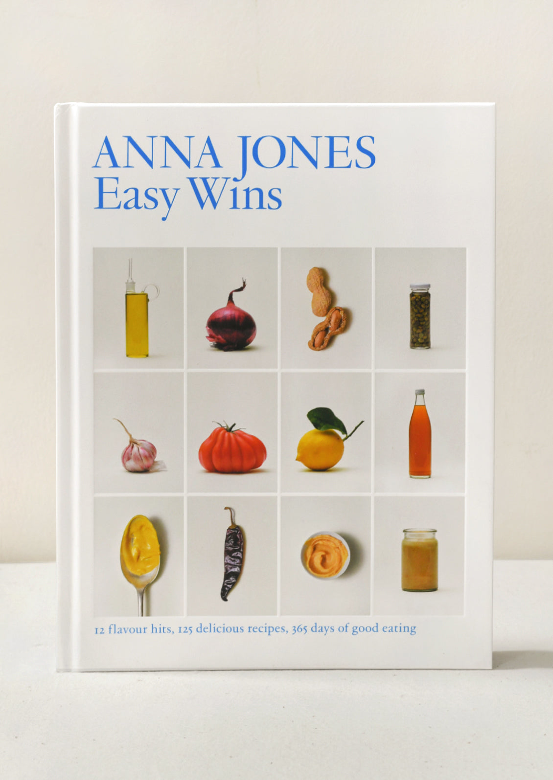 Book cover of the "Easy Wins" cookbook by Anna Jones.