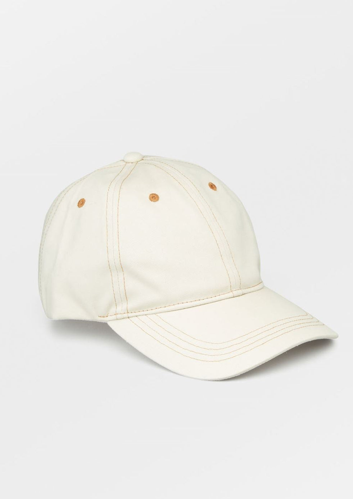 An ecru color baseball cap with contrast brown stitching.
