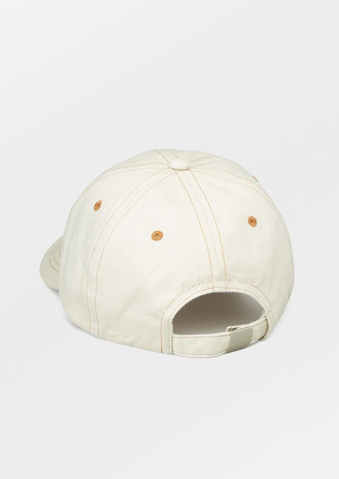 An ecru color baseball cap with contrast brown stitching.