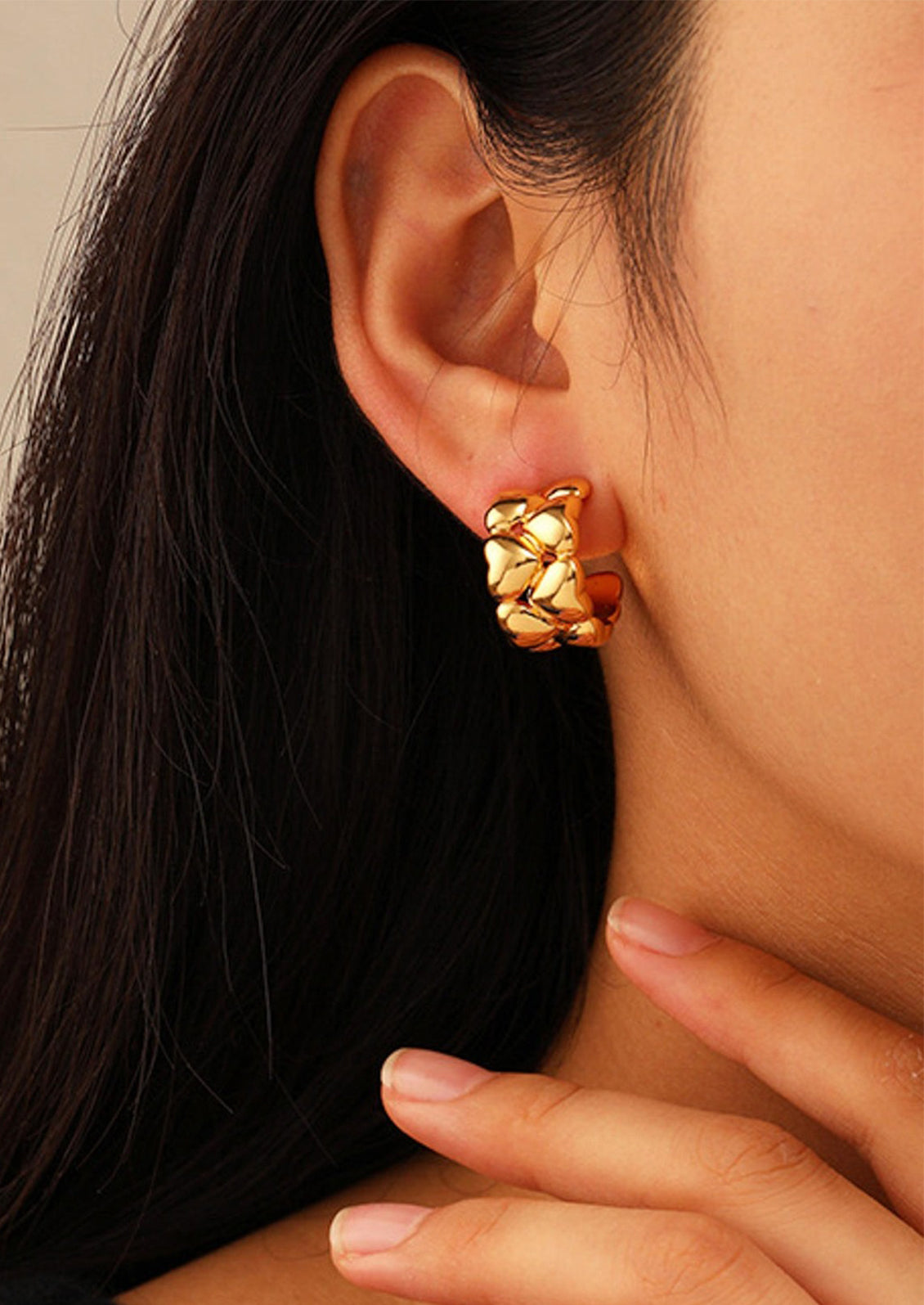 Hoop earrings composed of multiple hearts.