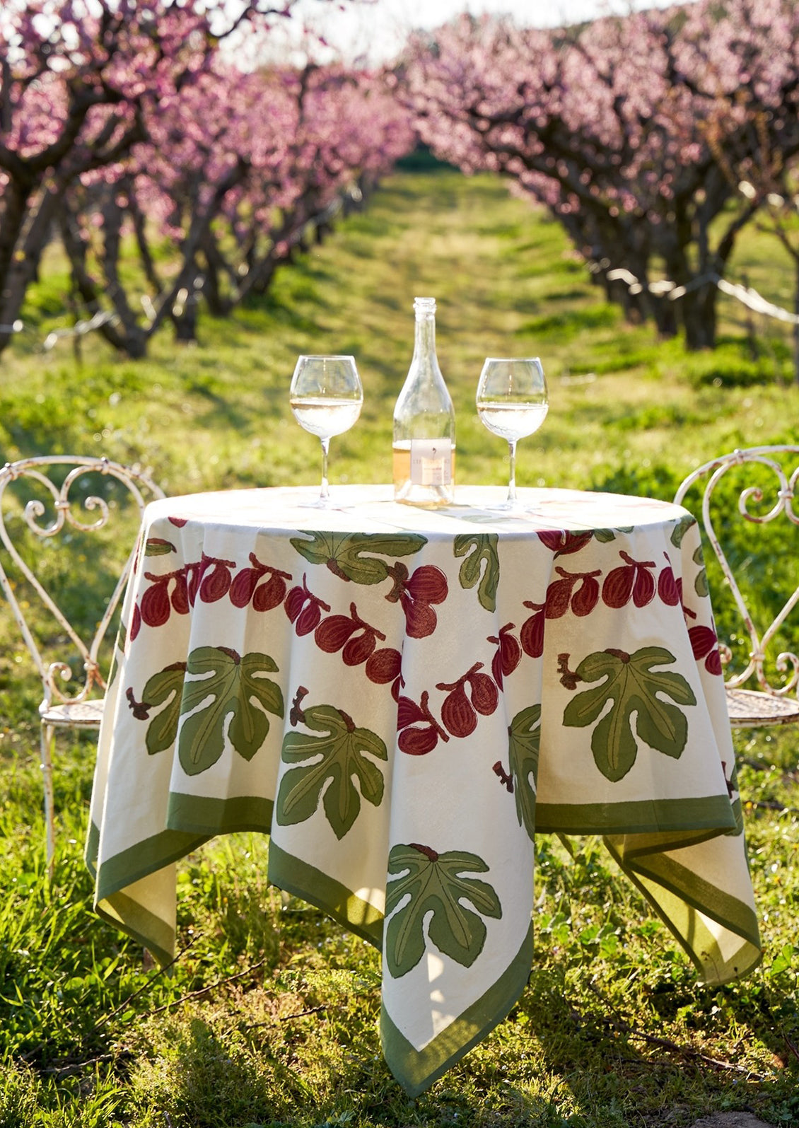 A block printed tablecloth with fig fruit and leaf pattern.