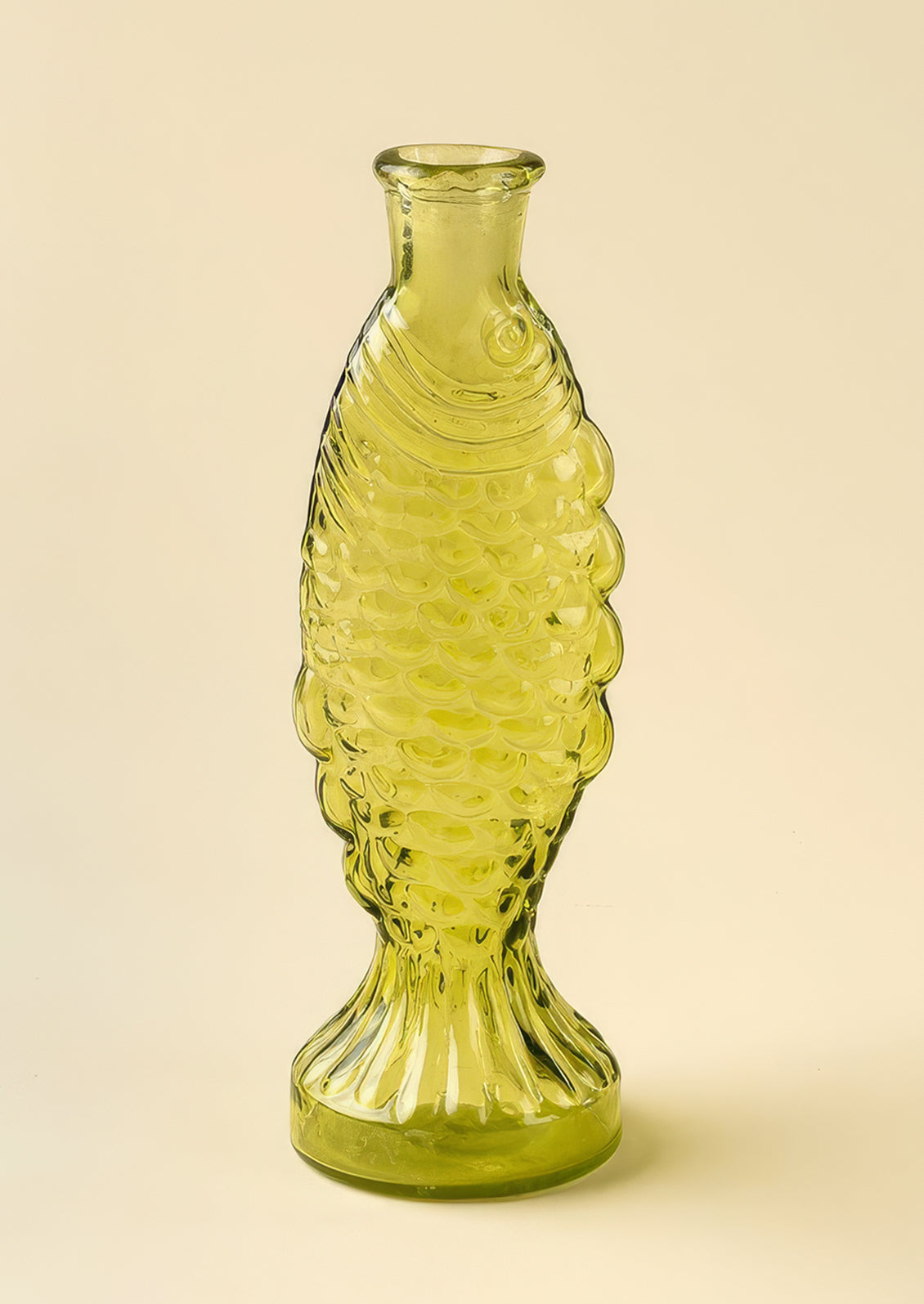 A glass vase/pitcher shaped like a fish.
