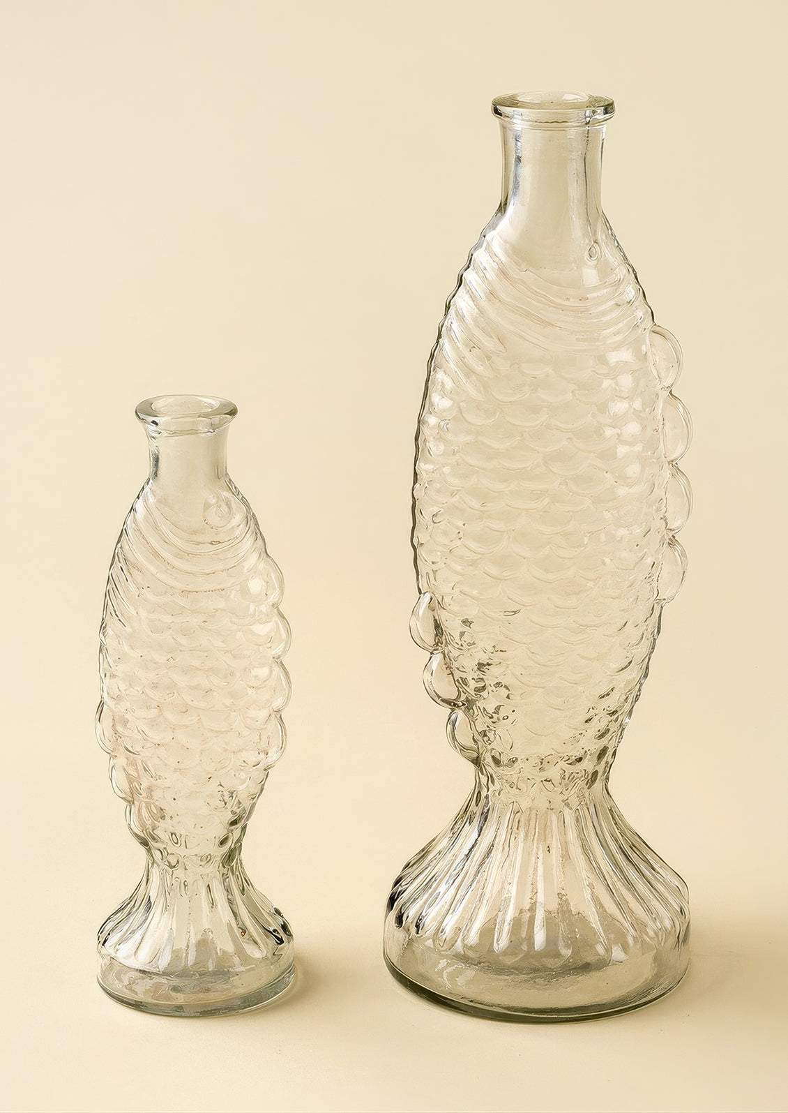 A glass vase/pitcher shaped like a fish.
