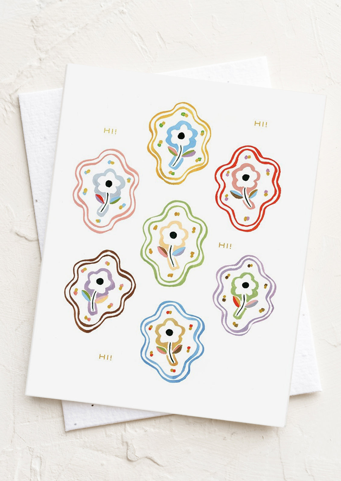 A floral illustrated card reading "Hi Hi Hi".