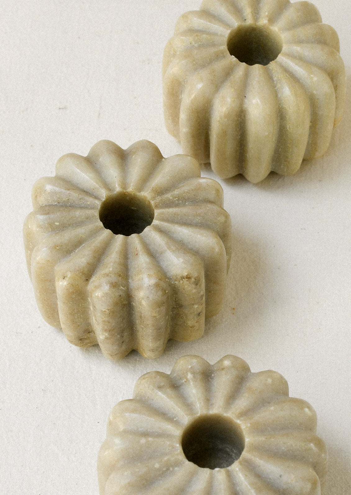 Fluted marble taper holders.
