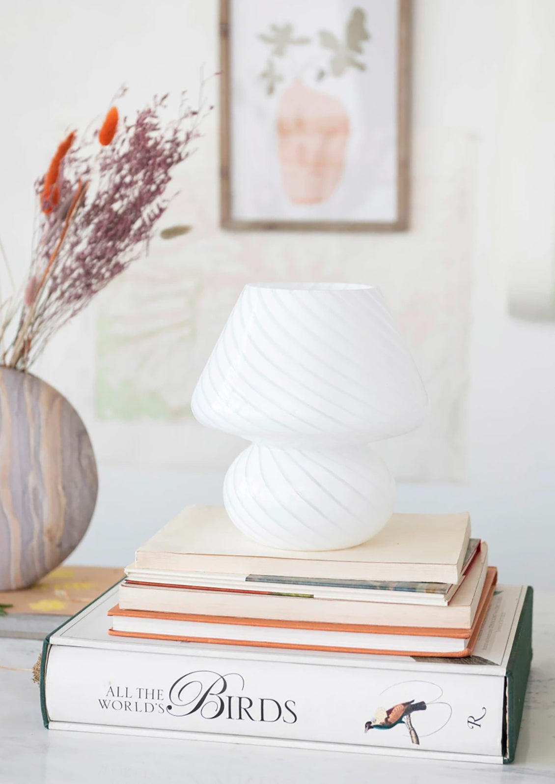 A white art glass table lamp with white/clear spiral pattern.