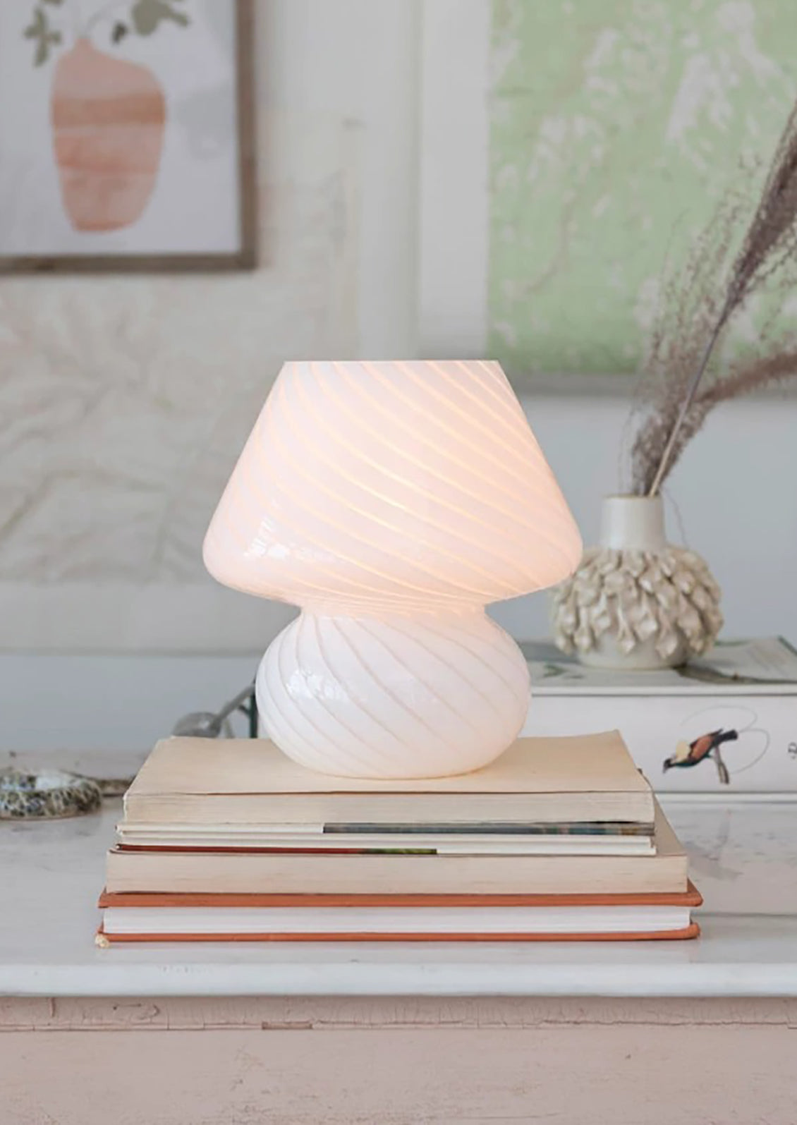 A white art glass table lamp with white/clear spiral pattern.