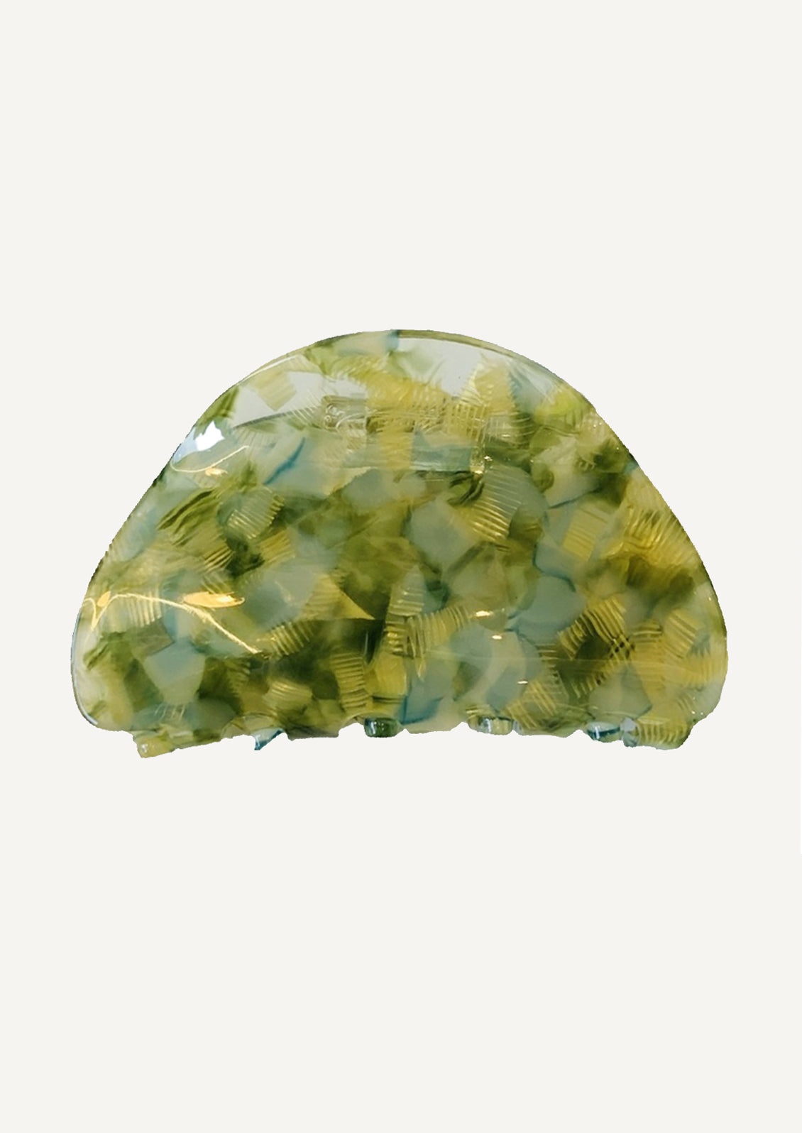 A curved hair claw in green speckle.