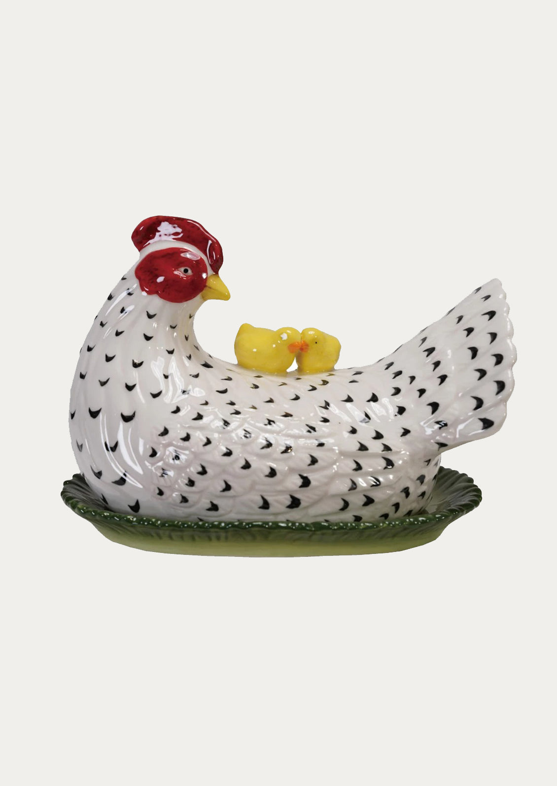 A large butter dish in the shape of a chicken.