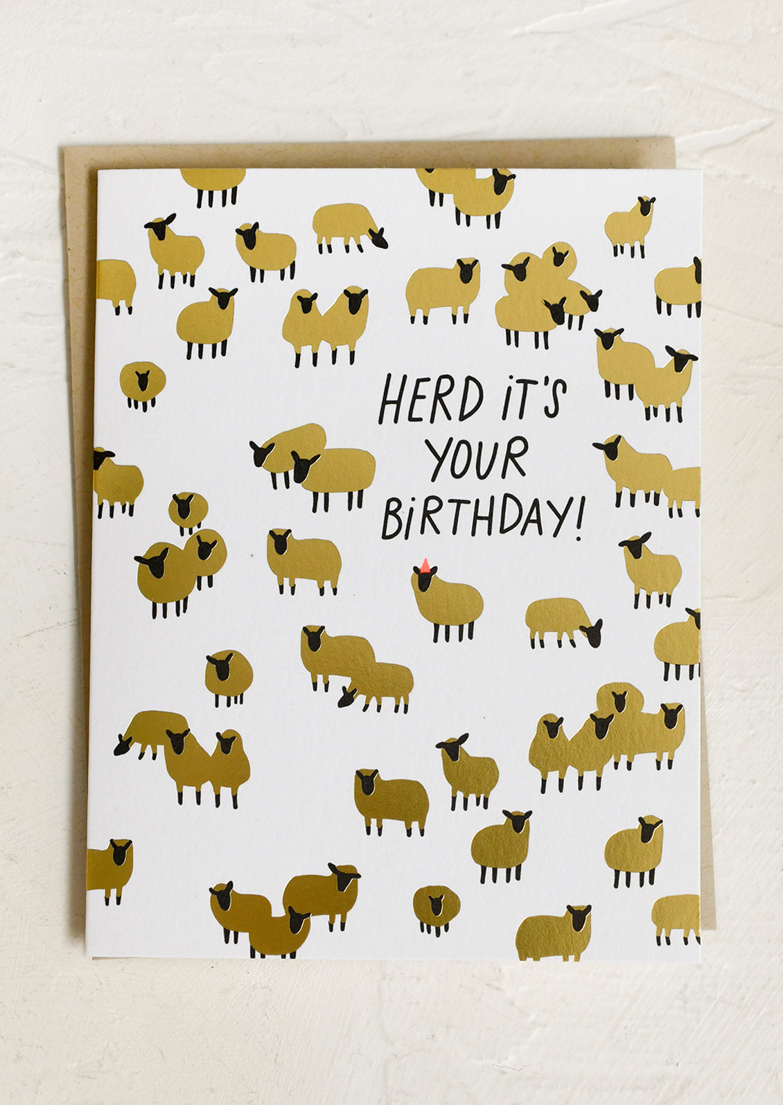 A greeting card picturing golden sheep, text reads "Herd it's your birthday".
