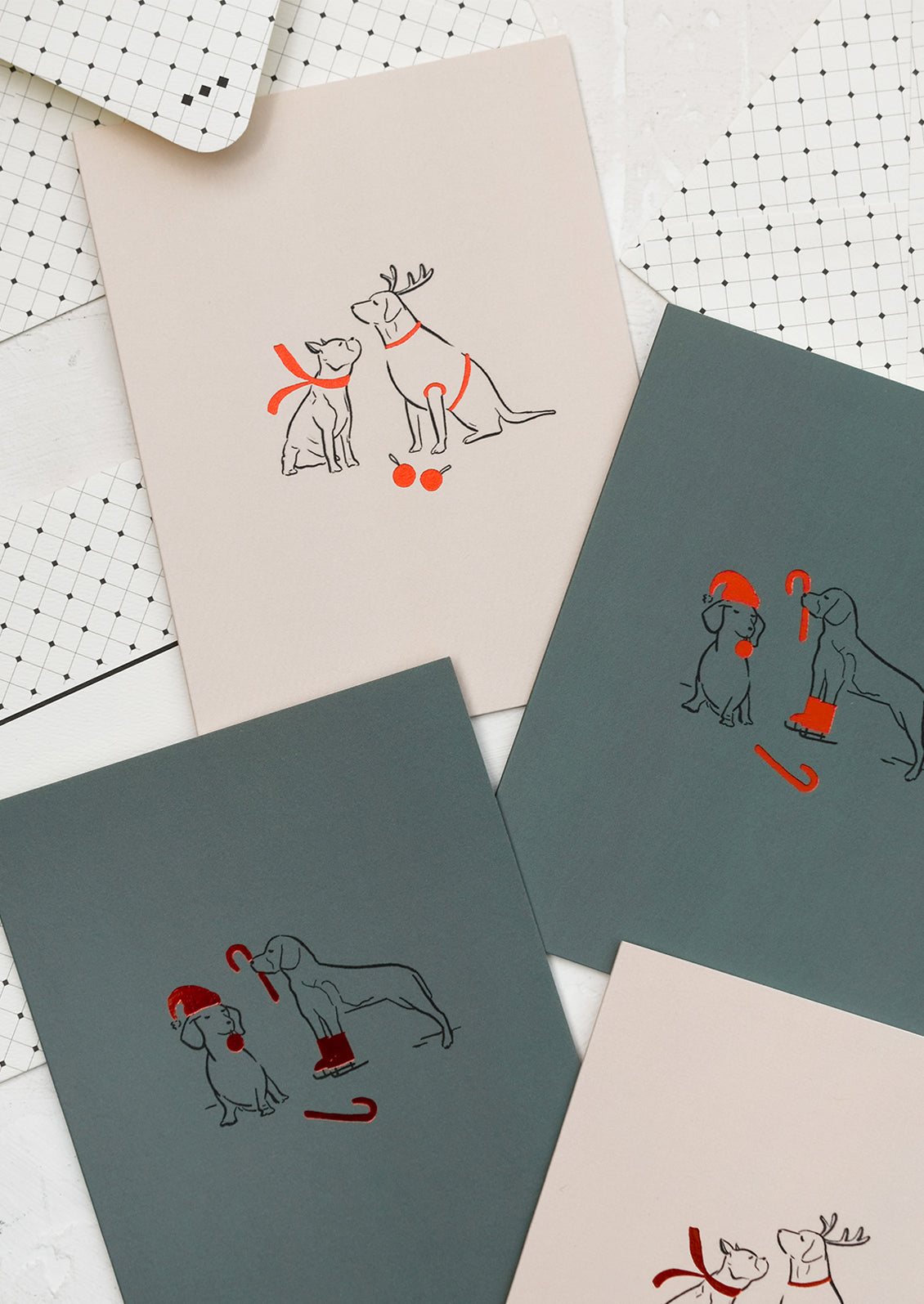 A card with illustration of two dogs wearing red scarves.