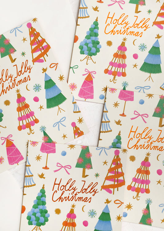 A colorful tree print card set reading "Holly jolly christmas".