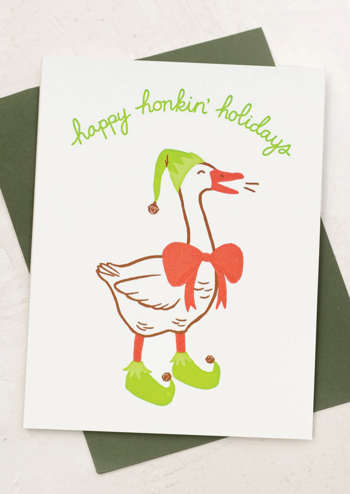 A greeting card with illustration of talking goose wearing bow, elf shoes and hat.