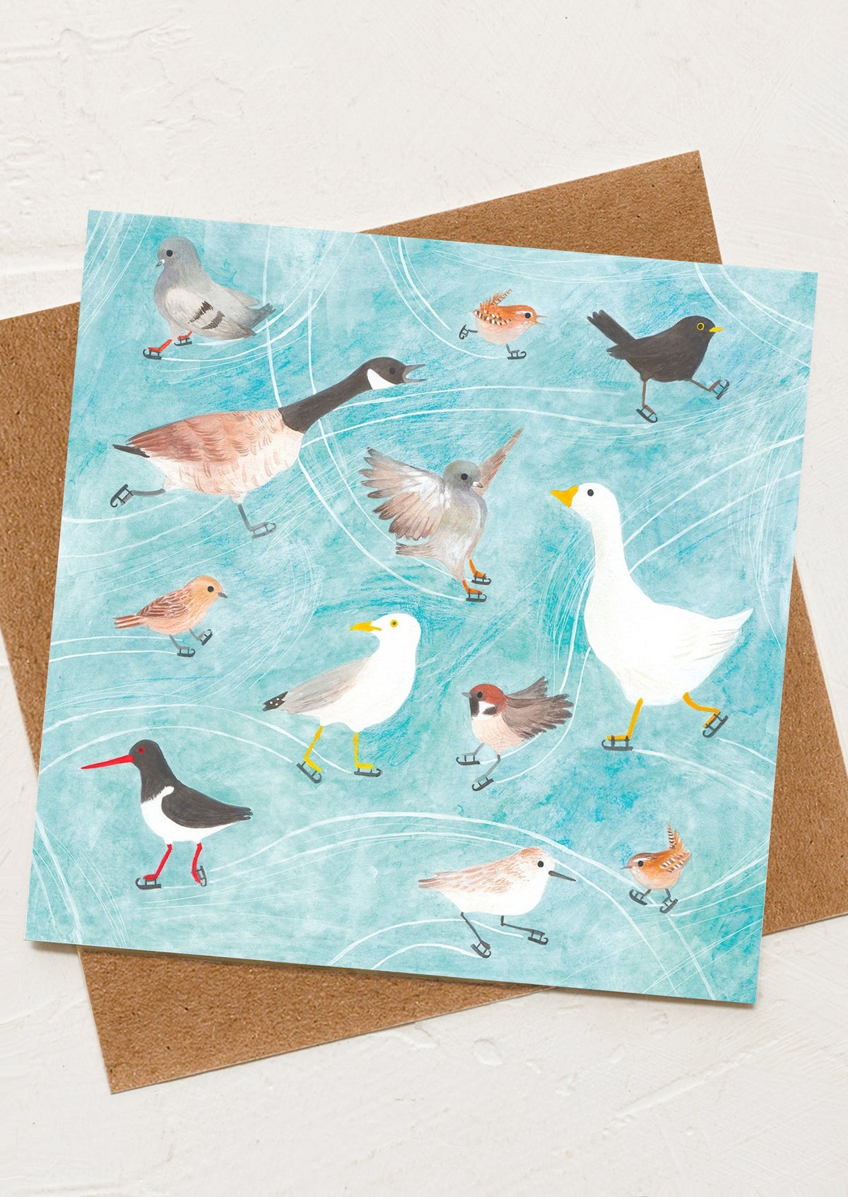 A greeting card with illustration of different birds on ice skates.