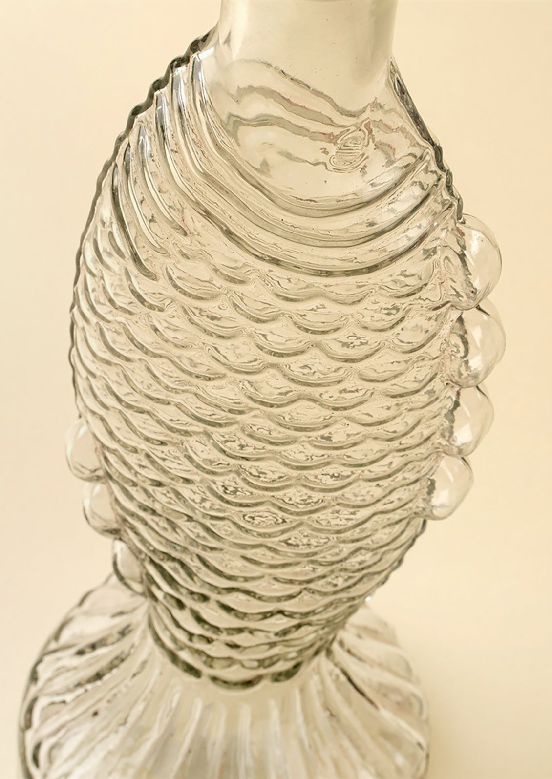 A glass vase/pitcher shaped like a fish.