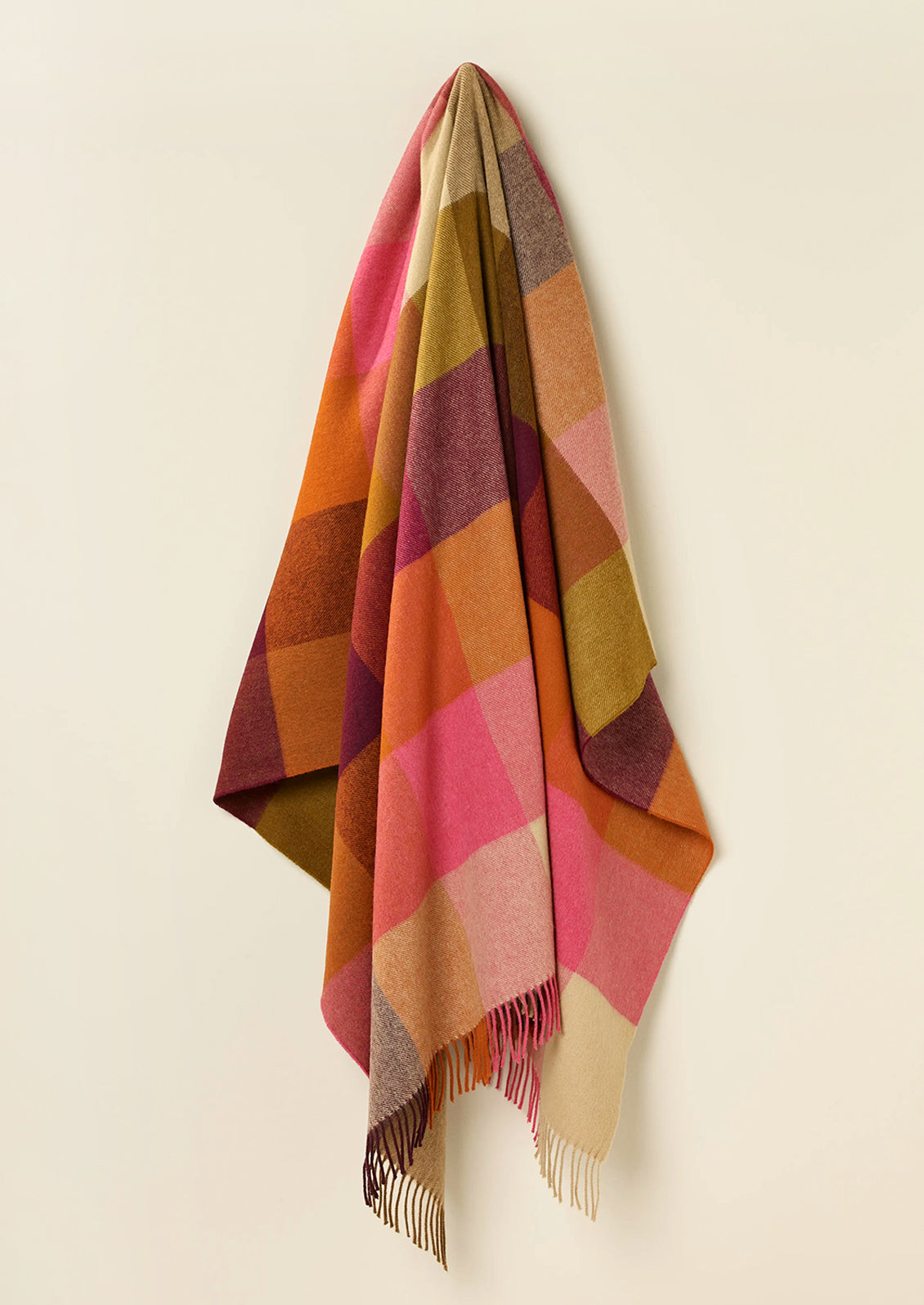 Colorful plaid blanket in burgundy multi.