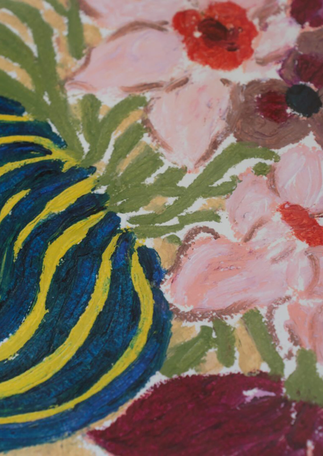 Close-up of a floral pattern with blue, pink, and green colors.