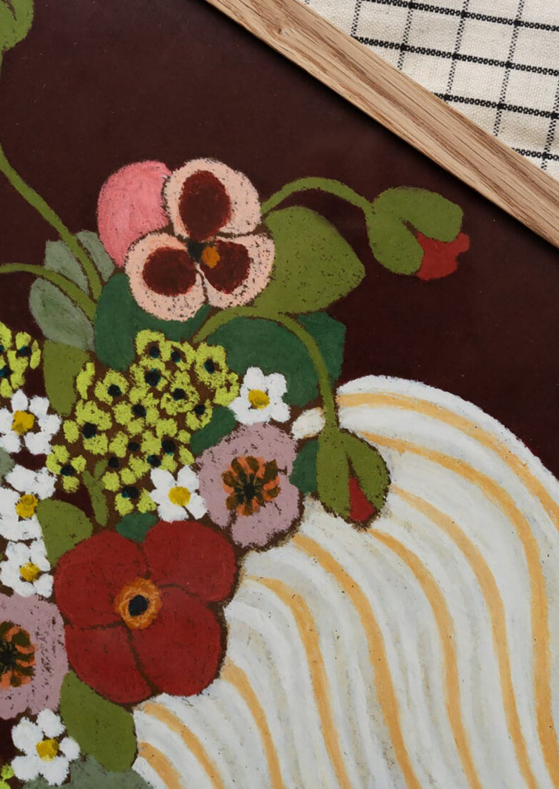 Floral design on a textured surface with a checkered fabric background