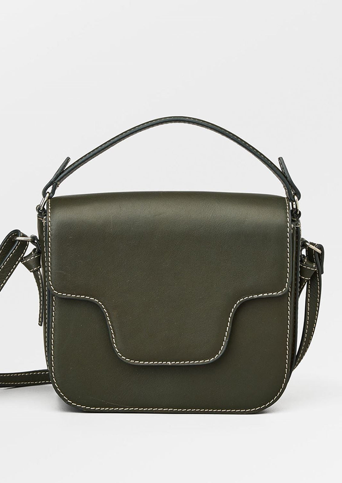A leather handbag in khaki green with white contrast stitching and flap front design.