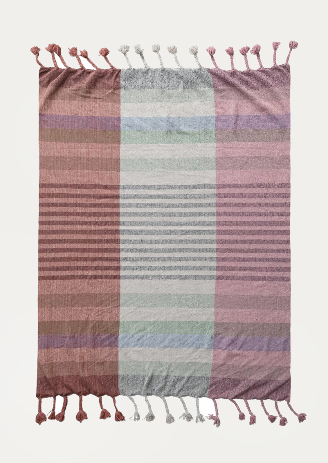 A cotton throw blanket with madras check pattern in shades of pink.