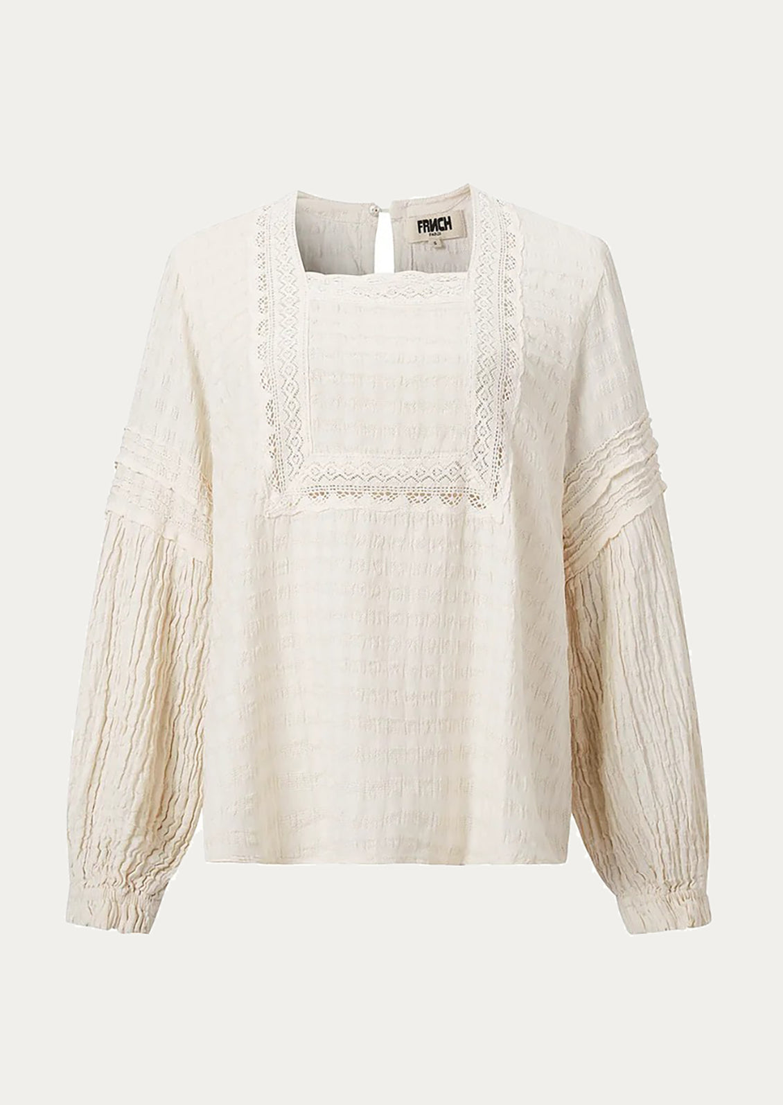 Beige blouse with lace details on a white background