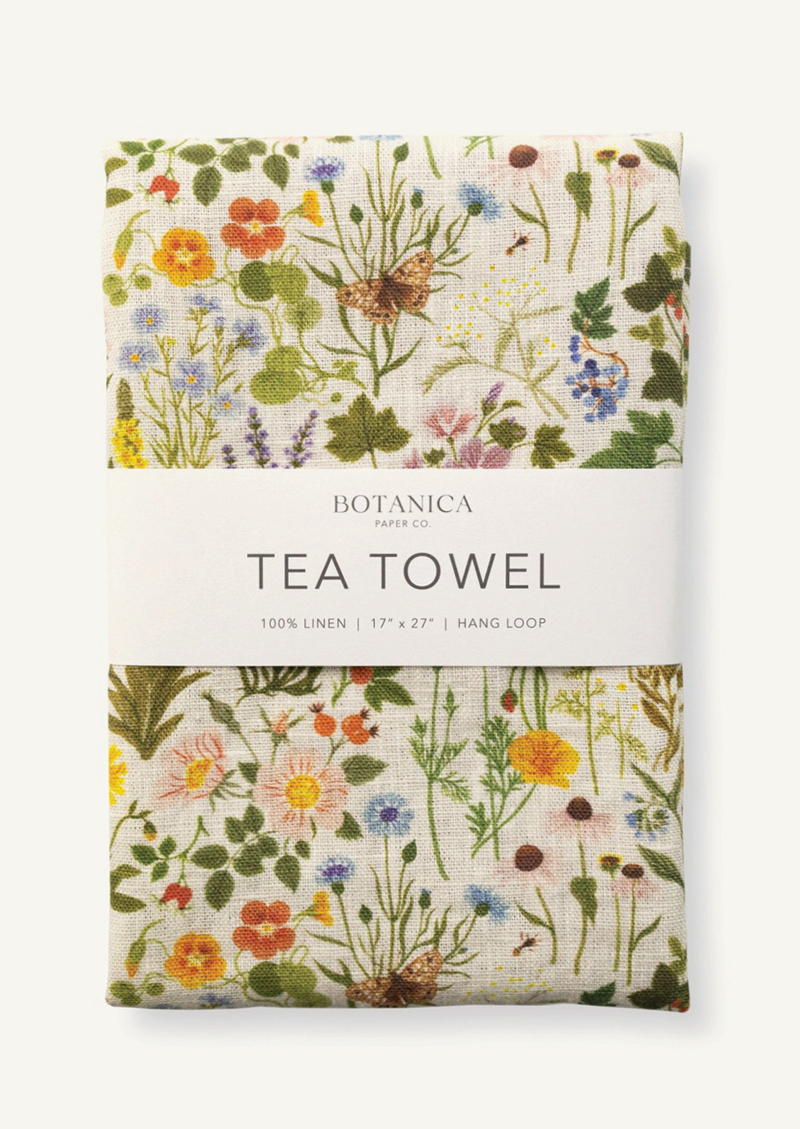 A linen tea towel with multicolor floral/botanical print.