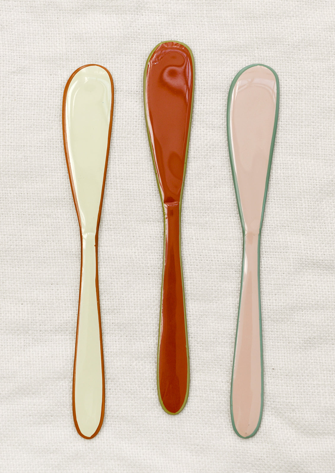 Enamel knifes in warm colors.