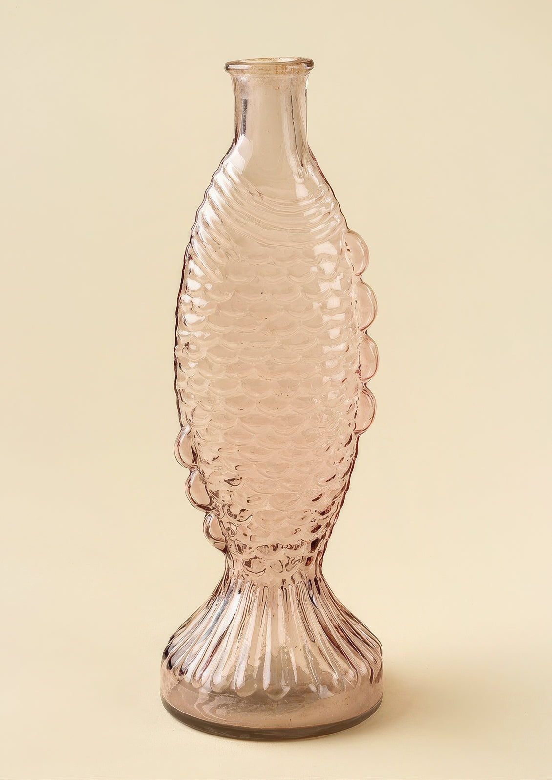 A glass vase/pitcher shaped like a fish.