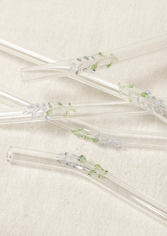 Clear glass straws with bent shape, with lampwork lavender figurine.