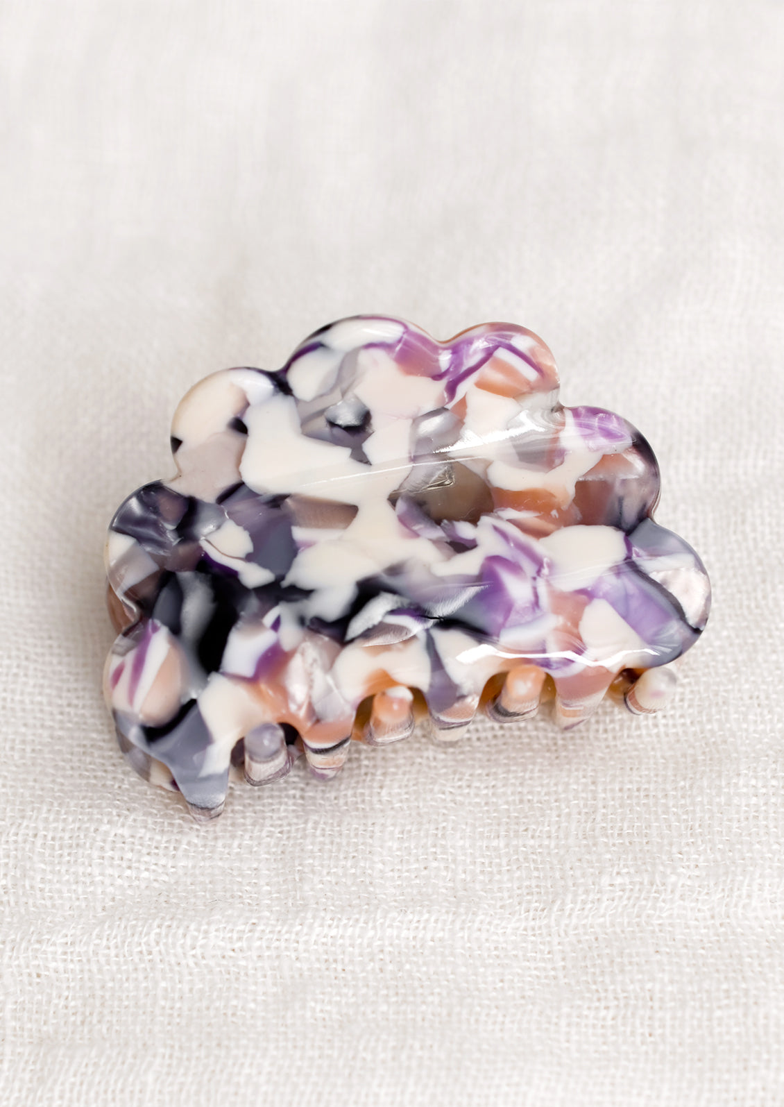 A cloud shaped small hair clip in lavender multi fleck.
