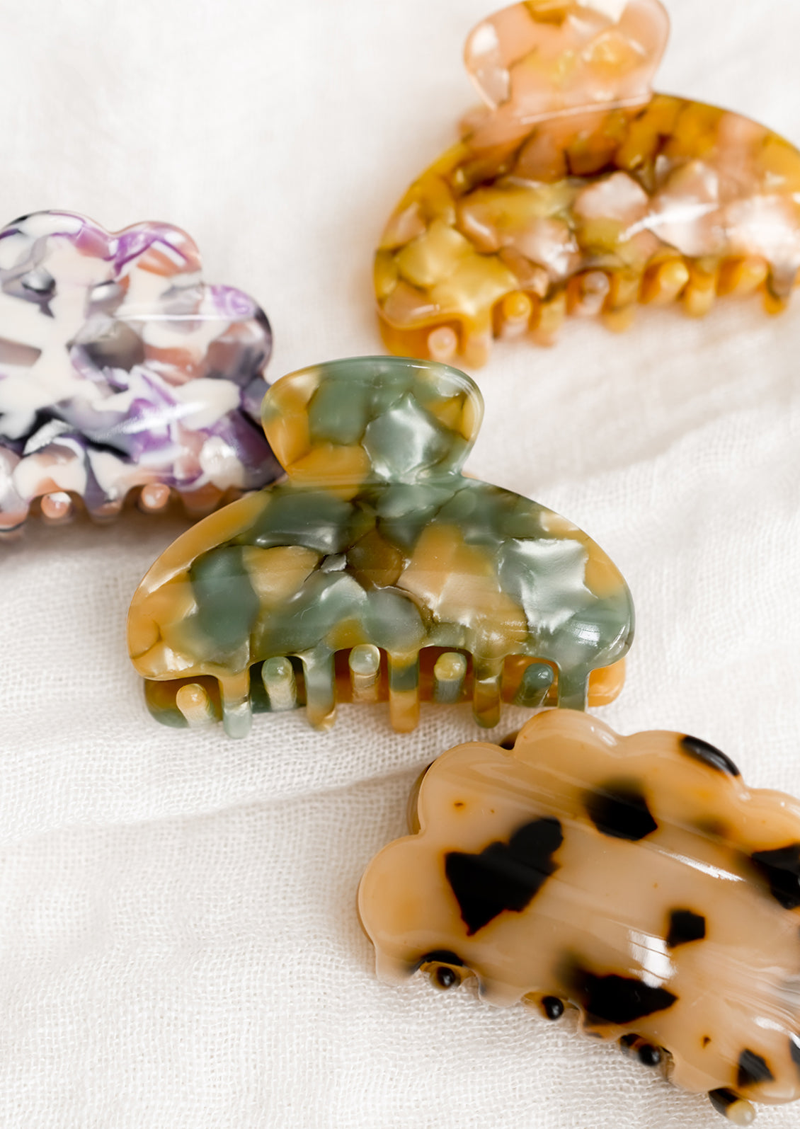Assorted small hair claws in a mix of colors and shapes.